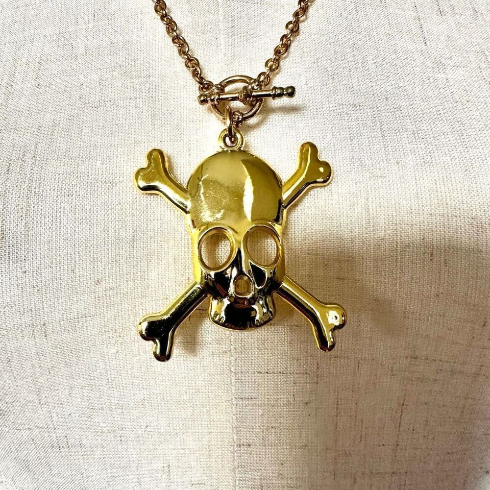 Gold tone skull cross bones necklace